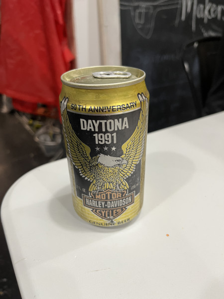Can of beer that reads "50th Anniversary Daytona 1991 Harley Davidson Genuine Beer"